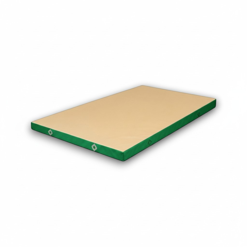 UK Gym Pits FIG approved soft topper landing mat with a beige jersey top and green PVC sides for gymnastics training.