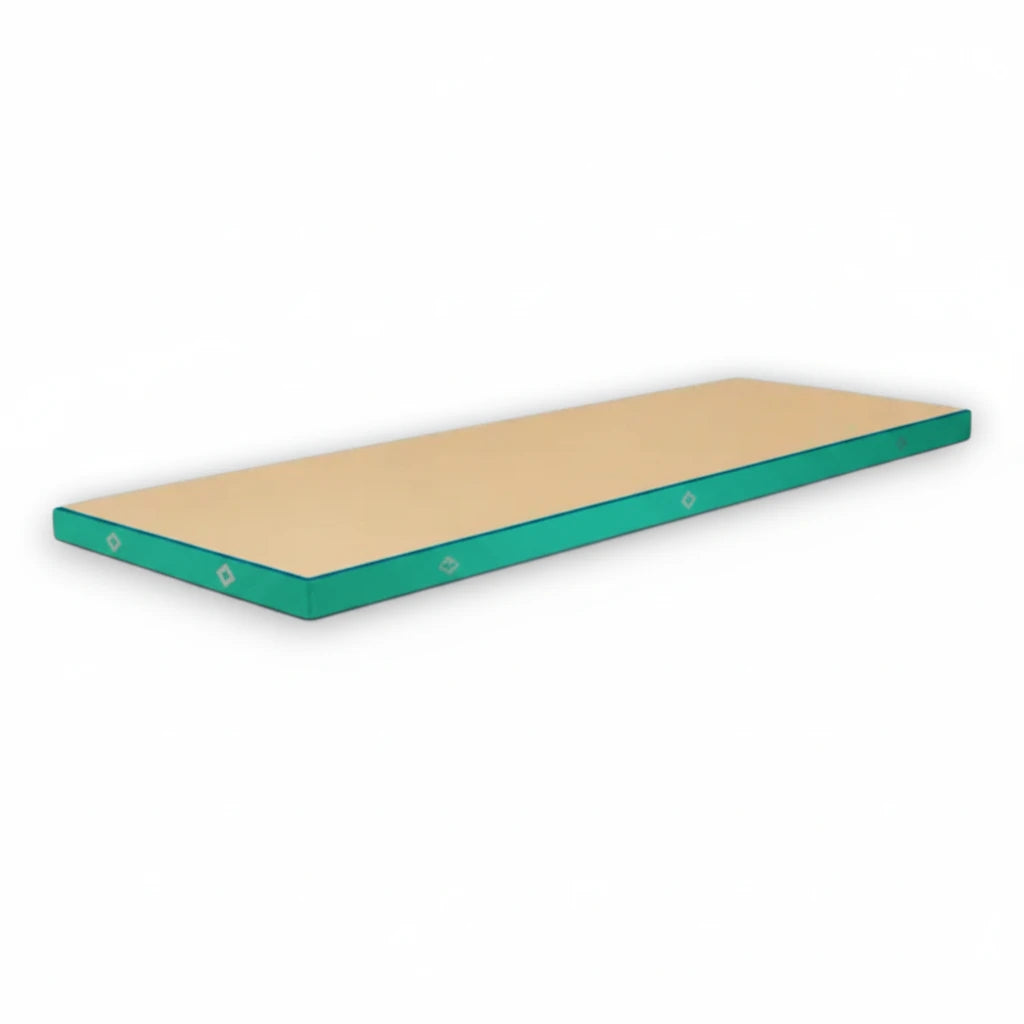 UK Gym Pits FIG approved soft topper landing mat with a beige jersey top and teal vinyl sides for gymnastics training.