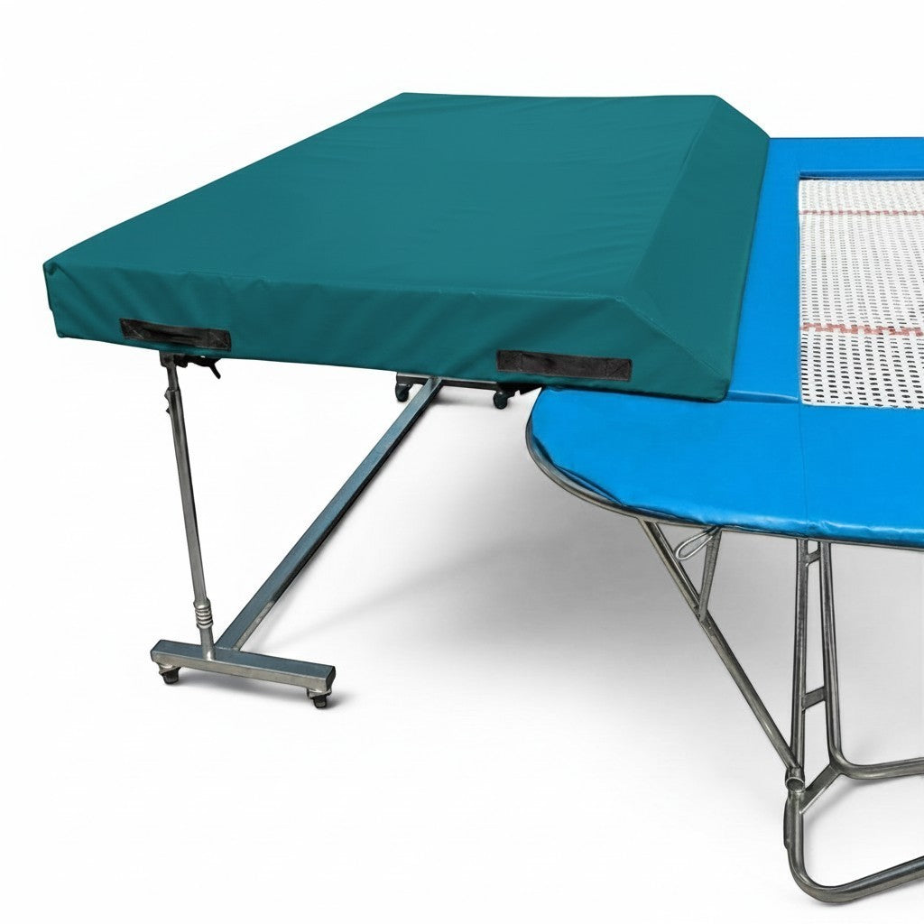 UK Gym Pits standard spotting end deck with teal wedge safety mat attached to a blue trampoline frame