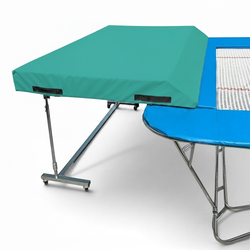 UK Gym Pits international spotting end deck with a teal wedged safety mat attached to a trampoline frame