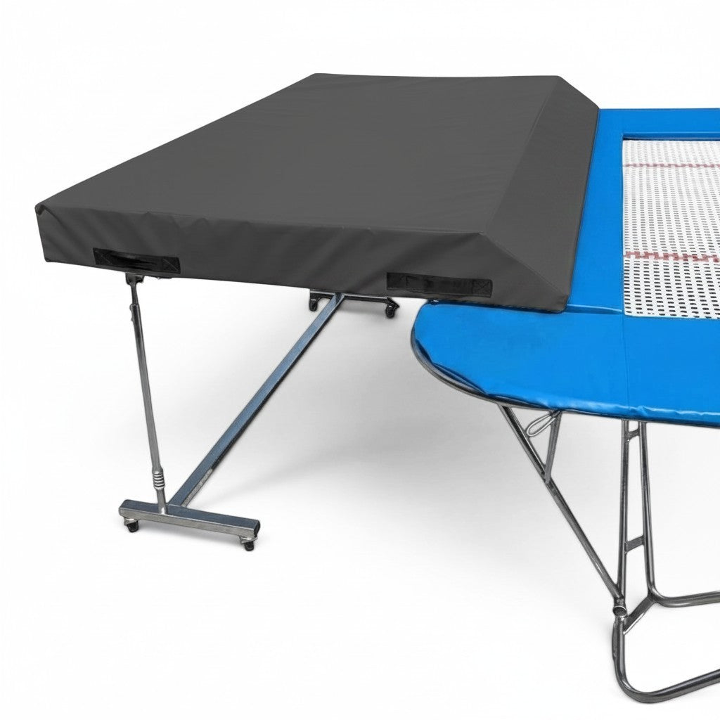 UK Gym Pits standard spotting end deck with grey wedged safety mat attached to a blue trampoline frame