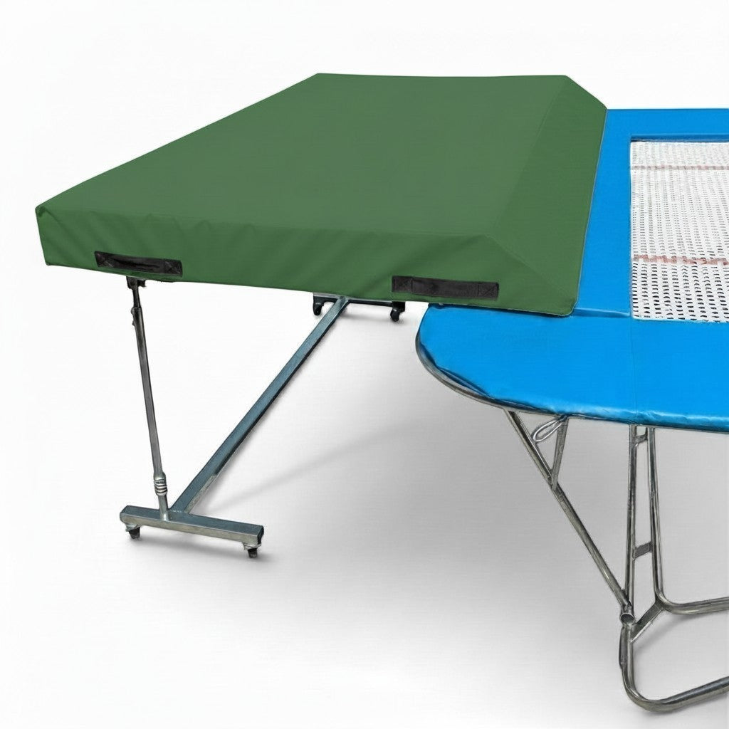 UK Gym Pits international spotting end deck with green wedged safety mat attached to a trampoline frame.