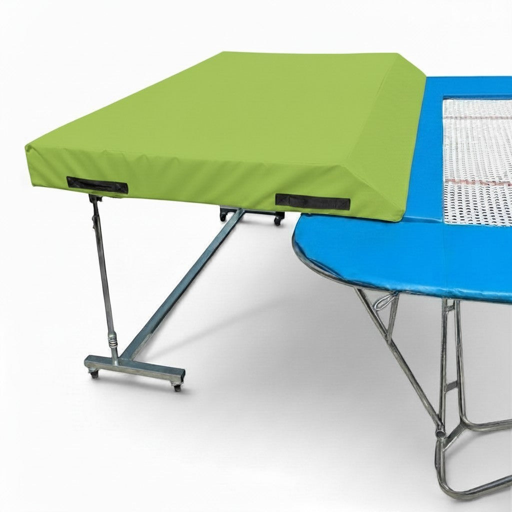 UK Gym Pits international spotting end deck with a lime green safety mat attached to a trampoline frame.