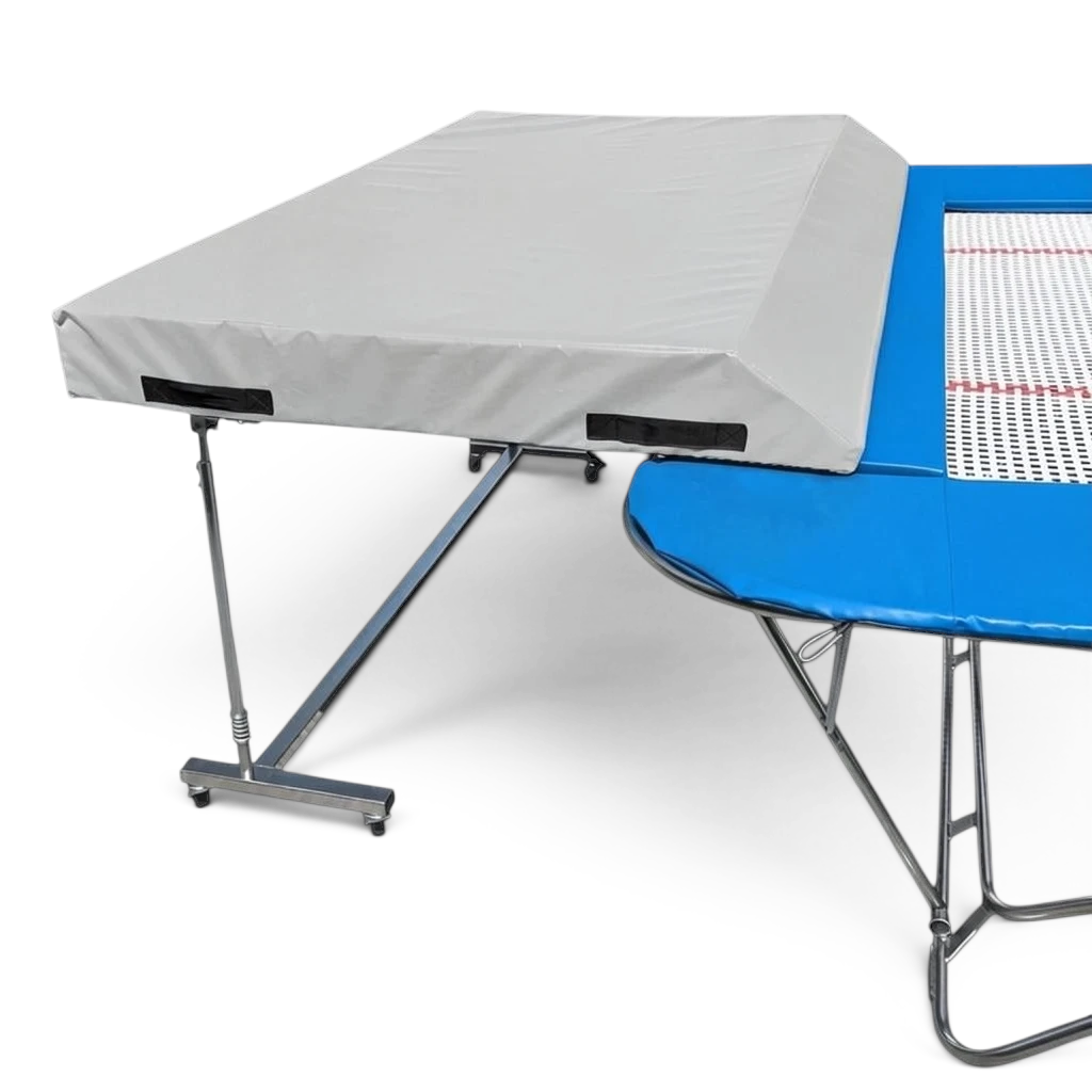 UK Gym Pits standard spotting end deck with a grey wedged safety mat attached to a blue trampoline frame.