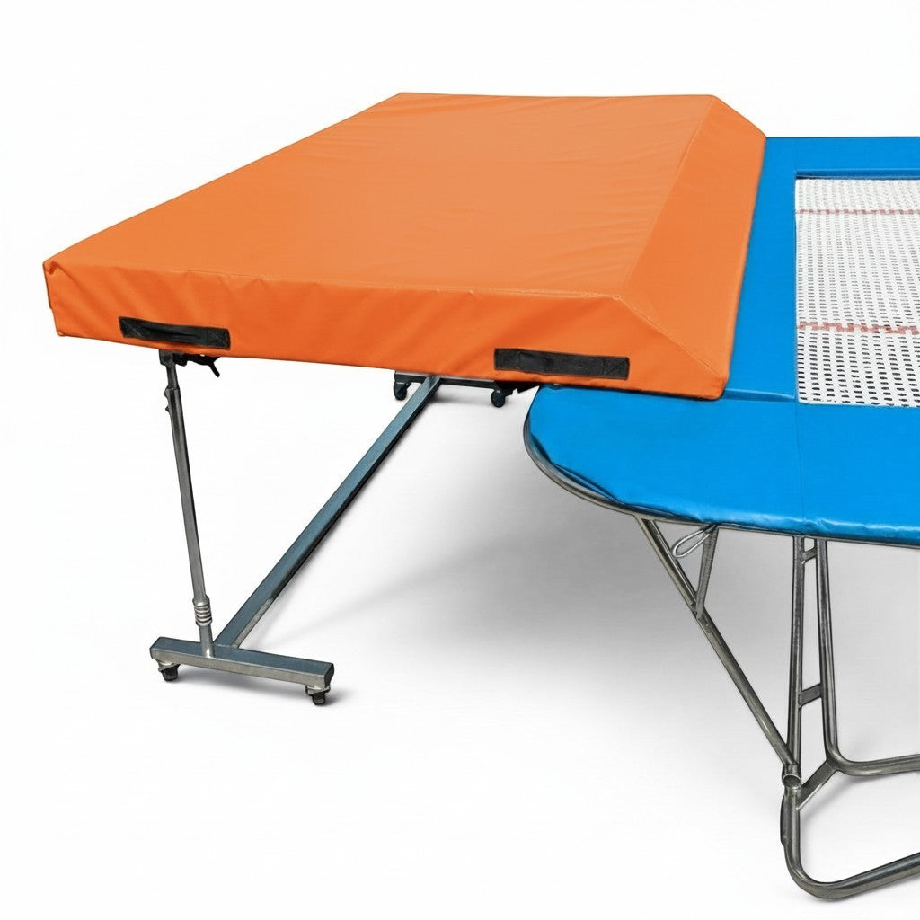 UK Gym Pits standard spotting end deck with orange wedge safety mat attached to a blue trampoline frame