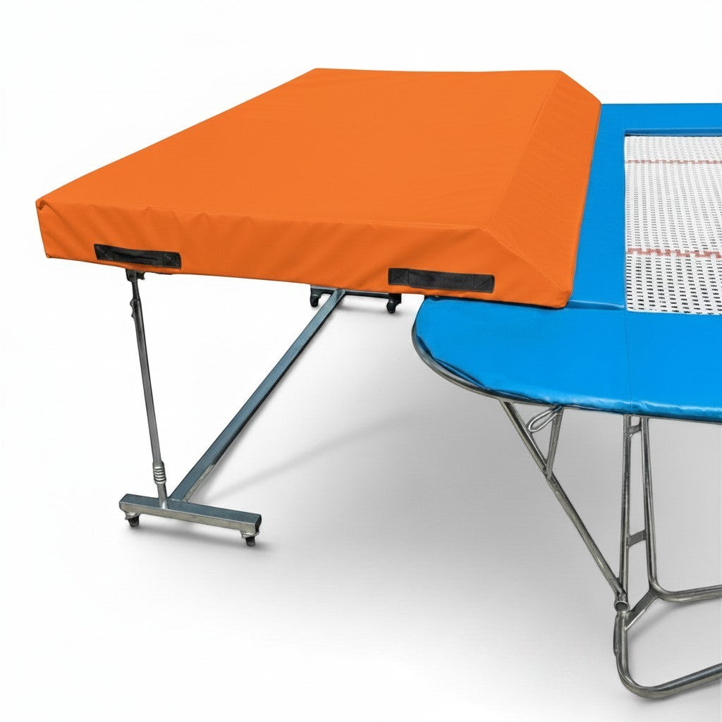 UK Gym Pits international spotting end deck with orange safety mat attached to a blue trampoline frame