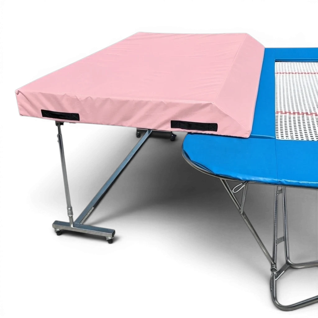 UK Gym Pits international spotting end deck with a pink wedged safety mat attached to a trampoline frame