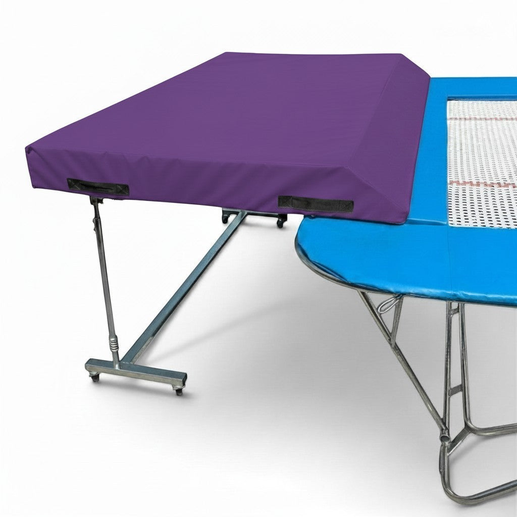 UK Gym Pits international spotting end deck with a purple wedged safety mat attached to a trampoline frame