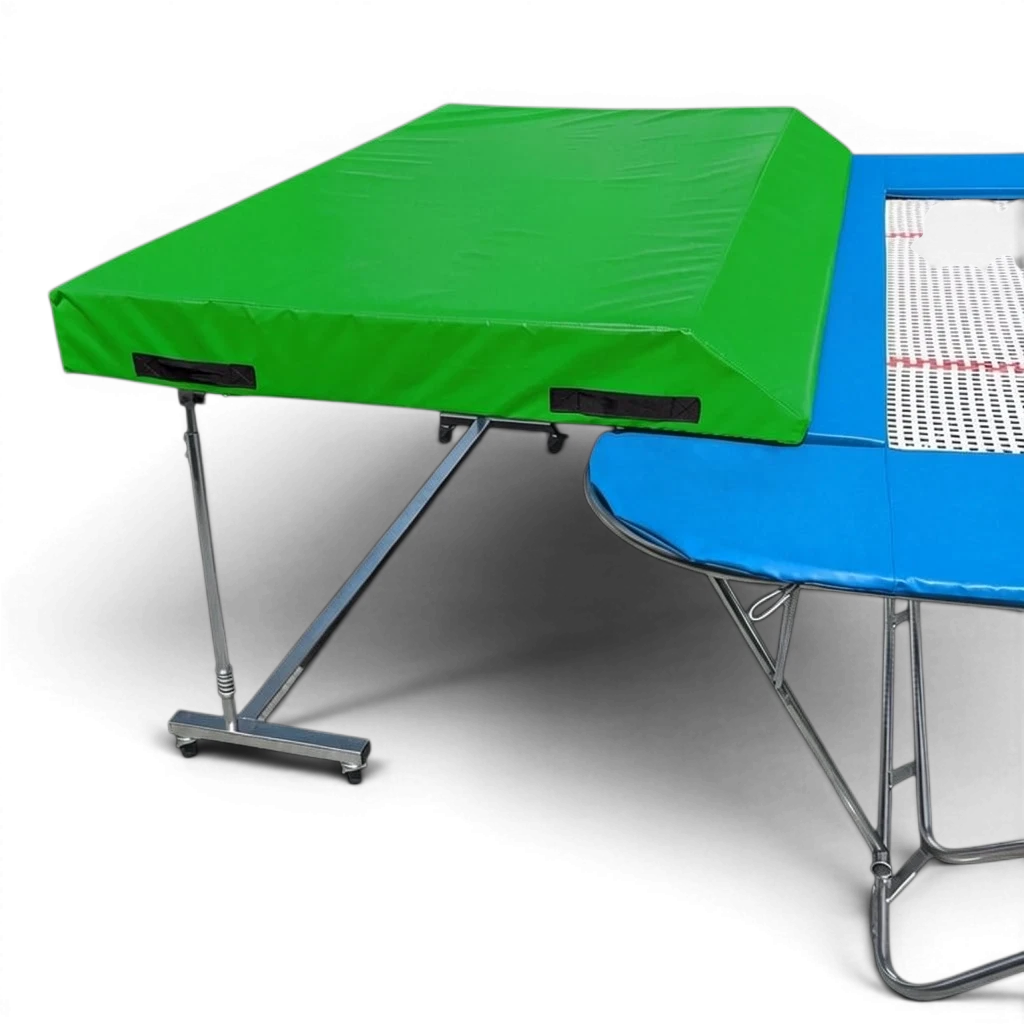 UK Gym Pits international spotting end deck with a green wedged safety mat attached to a blue trampoline frame