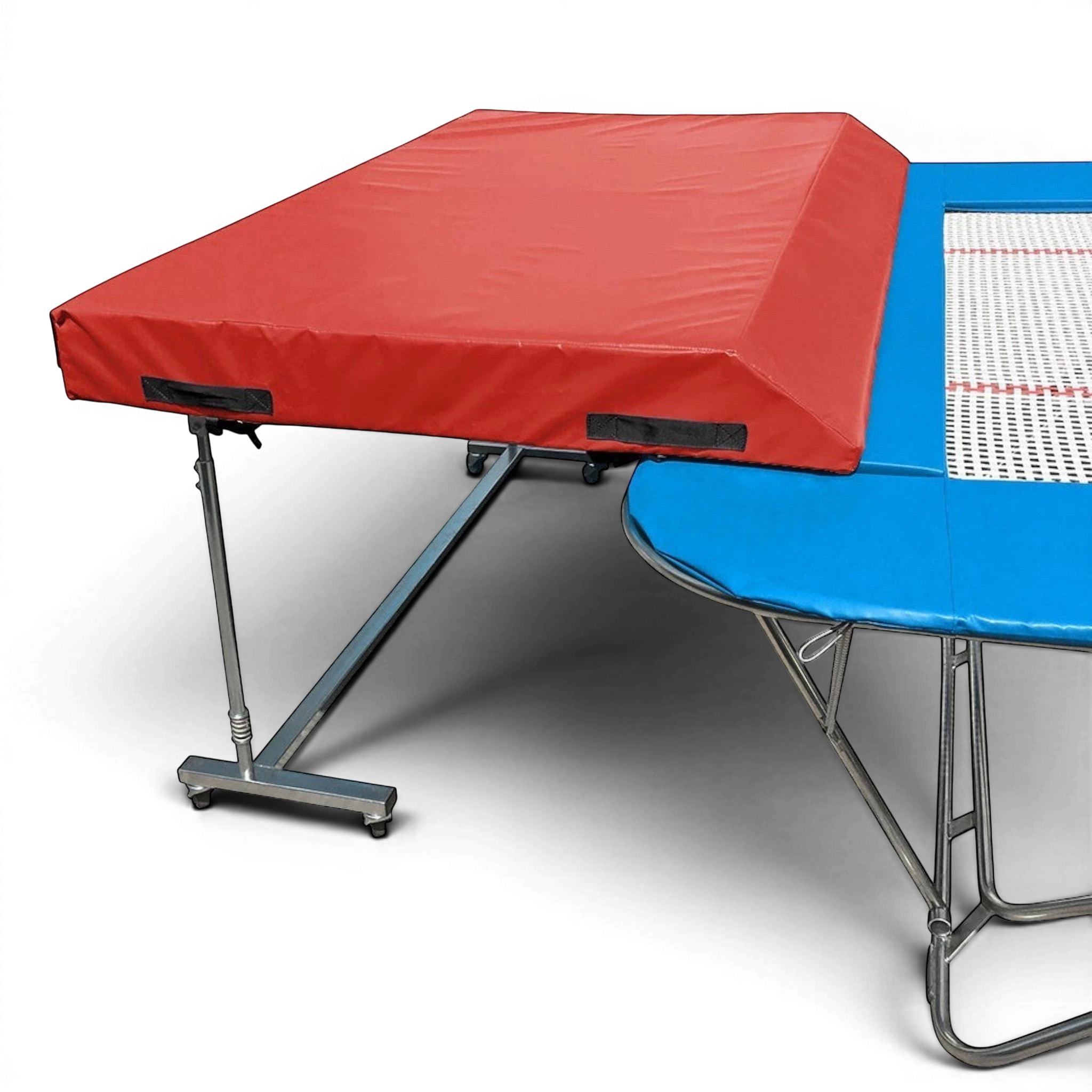 UK Gym Pits international spotting end deck with red wedged safety mat attached to a blue trampoline frame