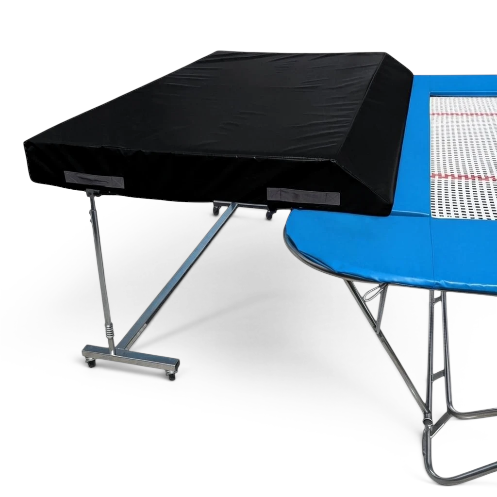 UK Gym Pits standard spotting end deck with black safety mat and height-adjustable silver frame attached to a trampoline
