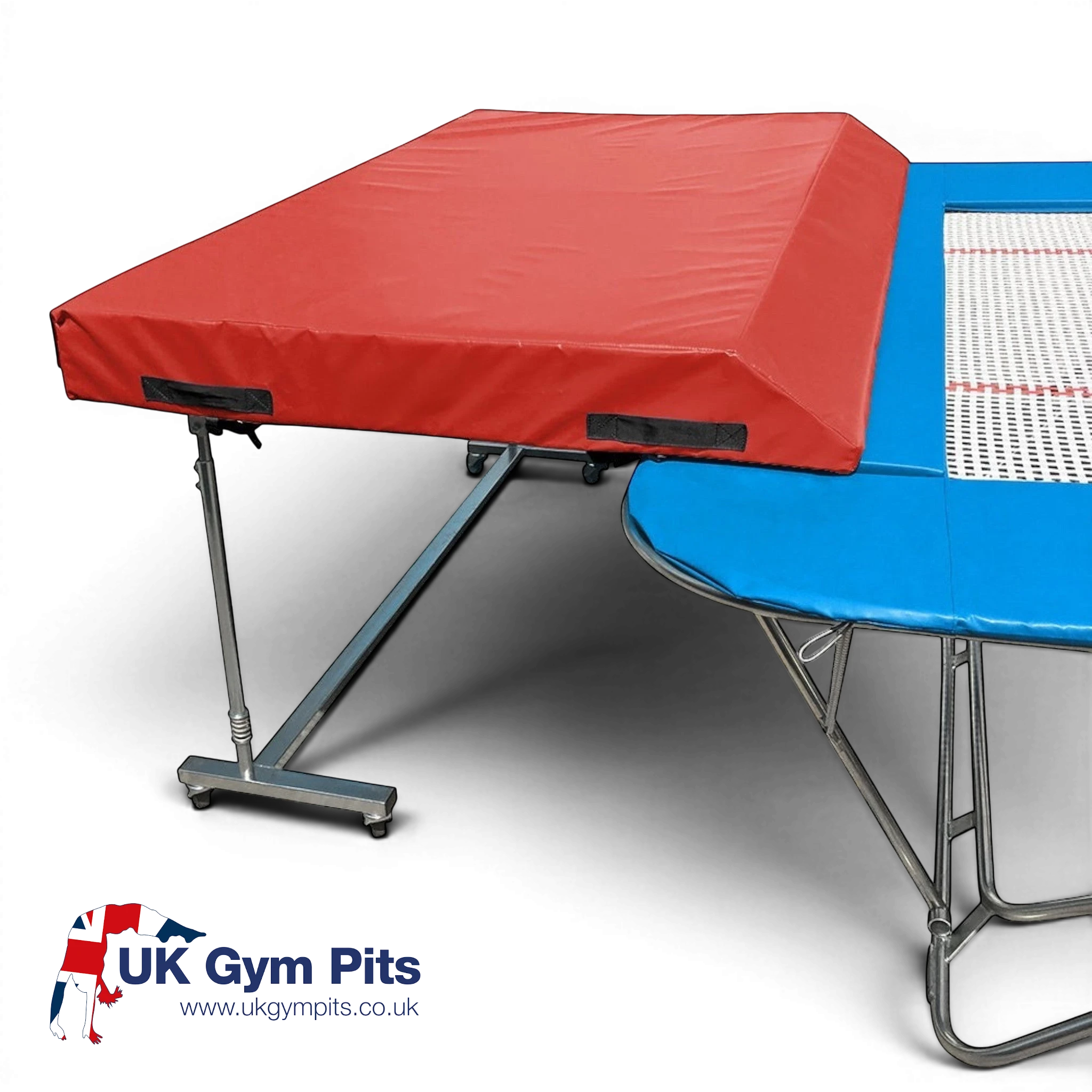 UK Gym Pits international spotting end deck with a red wedged safety mat attached to a trampoline frame