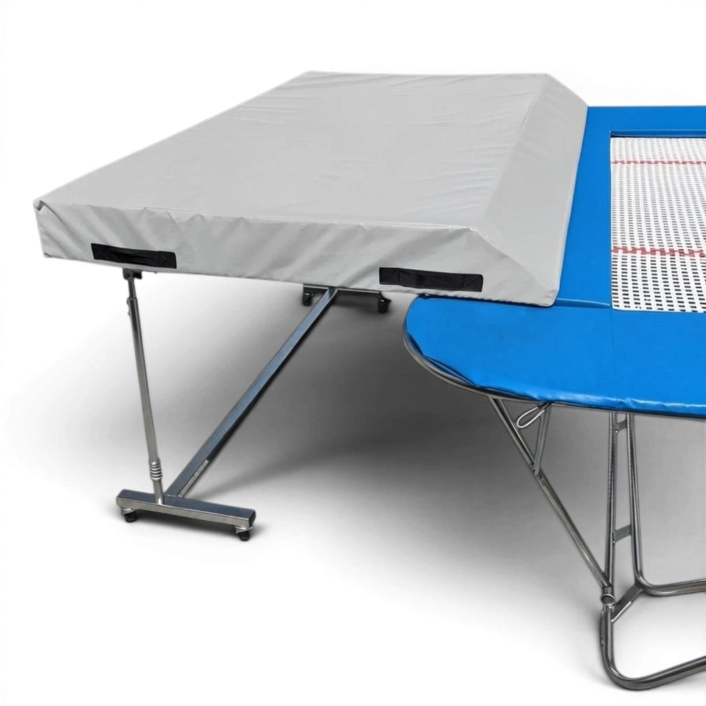 UK Gym Pits international spotting end deck with grey safety mat attached to a blue trampoline frame