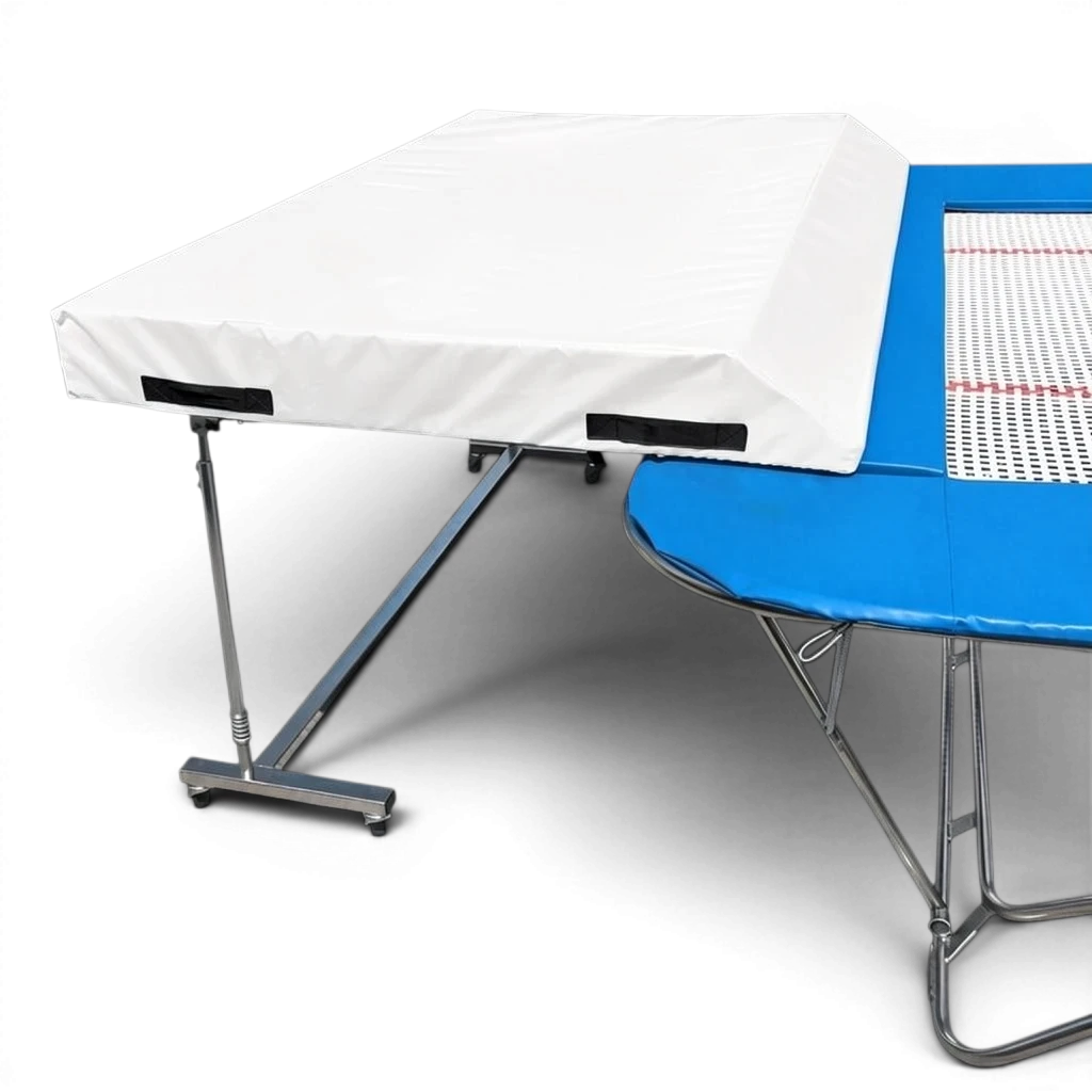 UK Gym Pits international spotting end deck with white safety mat attached to a blue trampoline frame