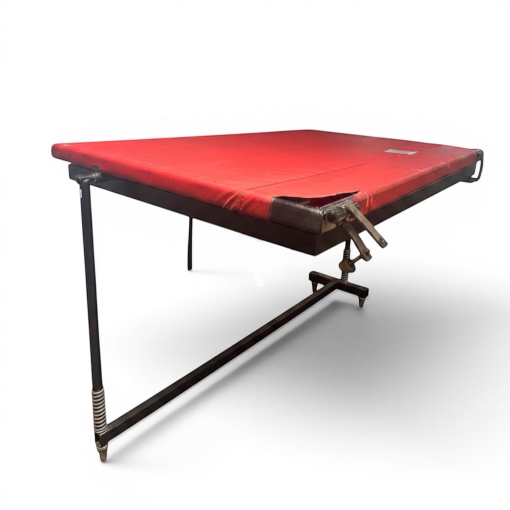 UK Gym Pits Continental International spotting end deck with a red padded surface and black adjustable folding frame.