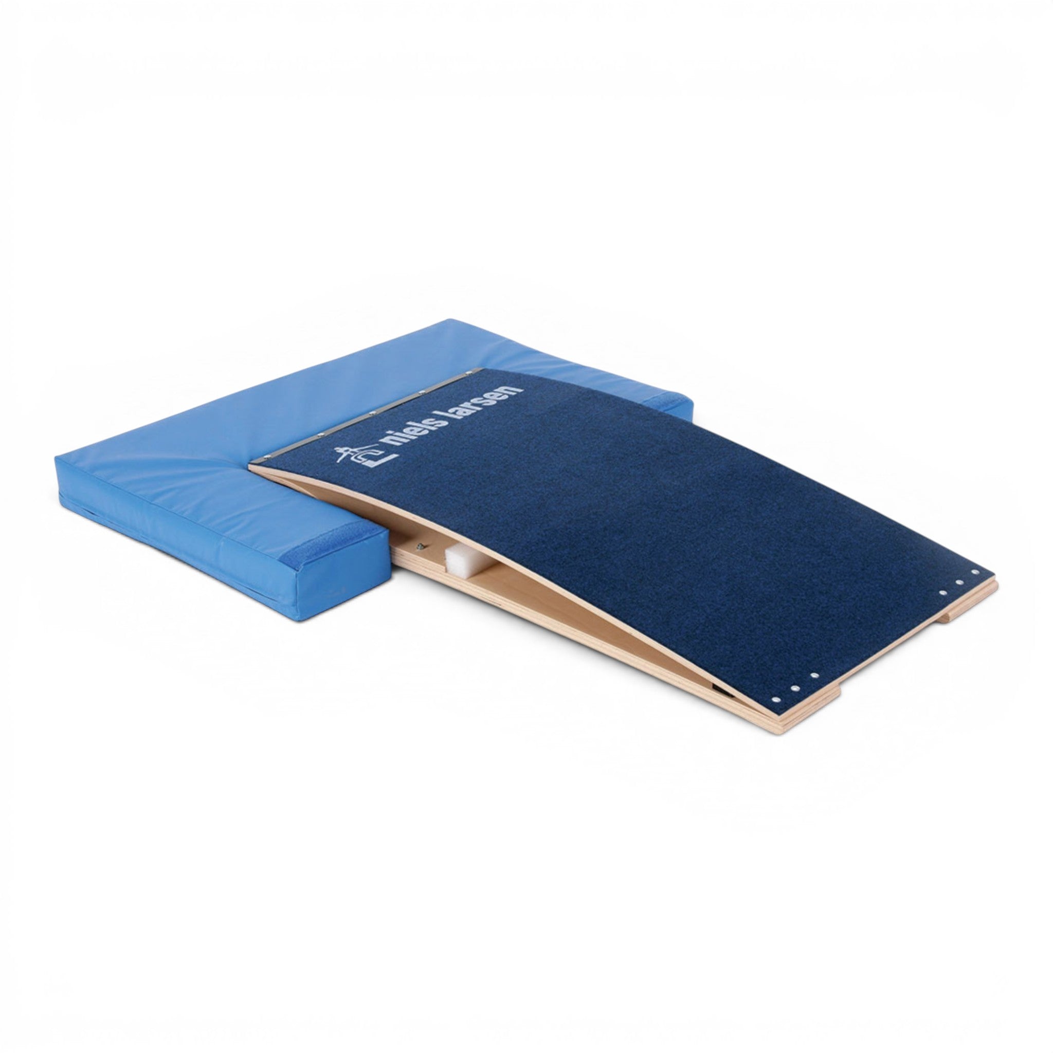 UK Gym Pits blue foam springboard surround attached to a gymnastics springboard with a dark blue carpeted surface