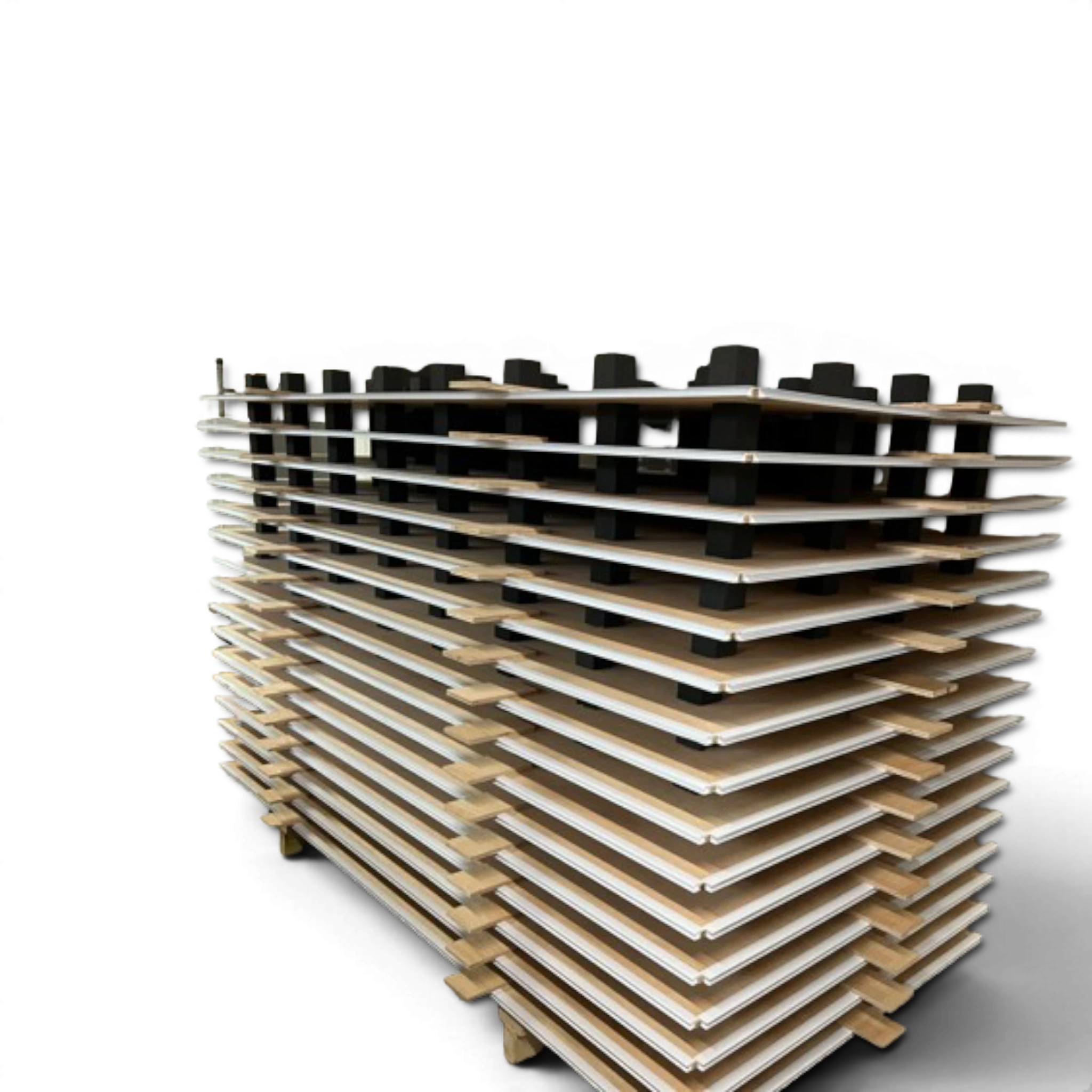 UK Gym Pits gymnastics sprung floor plywood panels stacked with pre-installed black EDPM foam blocks for shock absorption.