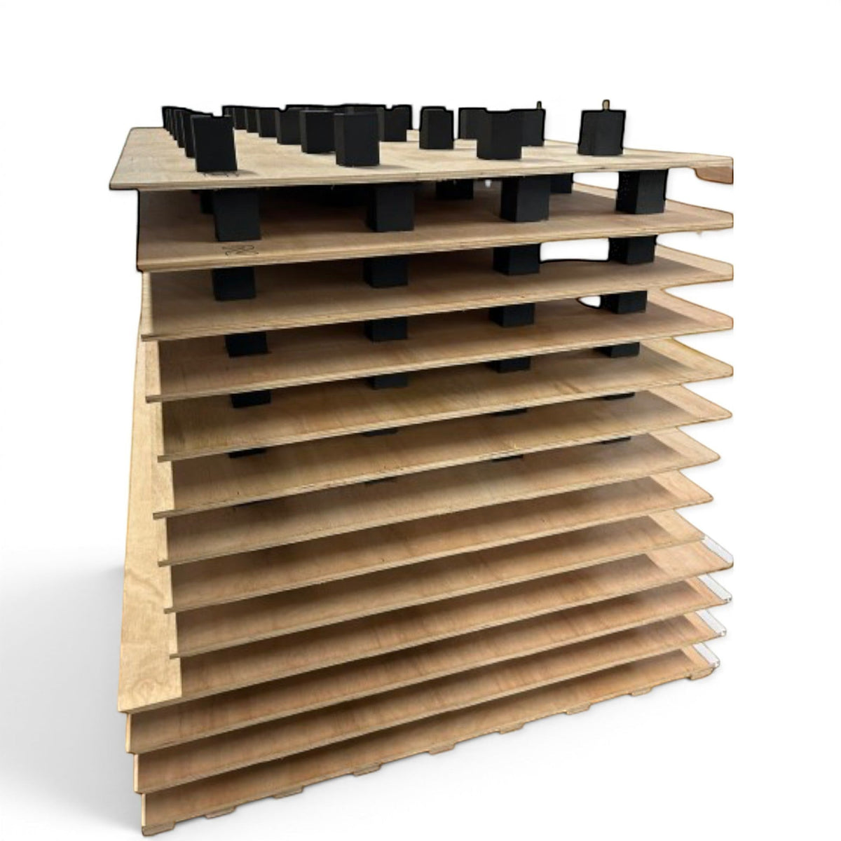 UK Gym Pits sprung tumble floor showing stacked dual plywood layers with black EDPM foam blocks for high elasticity