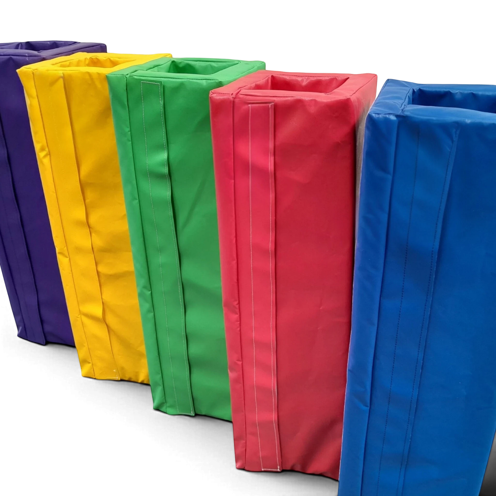 UK Gym Pits square foam post protectors in purple, yellow, green, red, and blue PVC for gym safety padding.