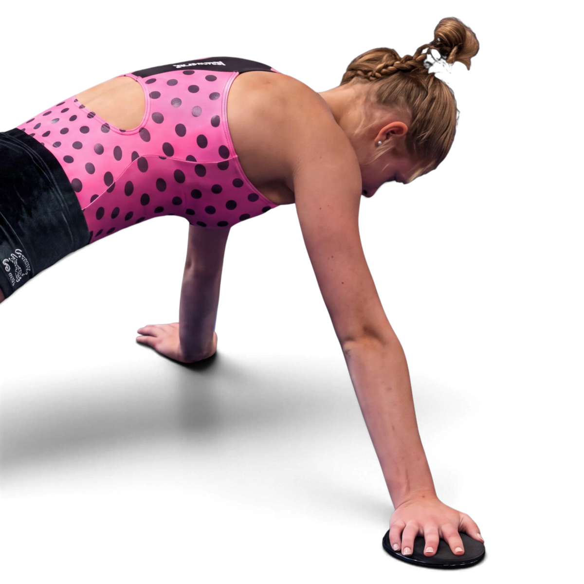 UK Gym Pits athlete using a standard slider for core conditioning and flexibility training on a black background
