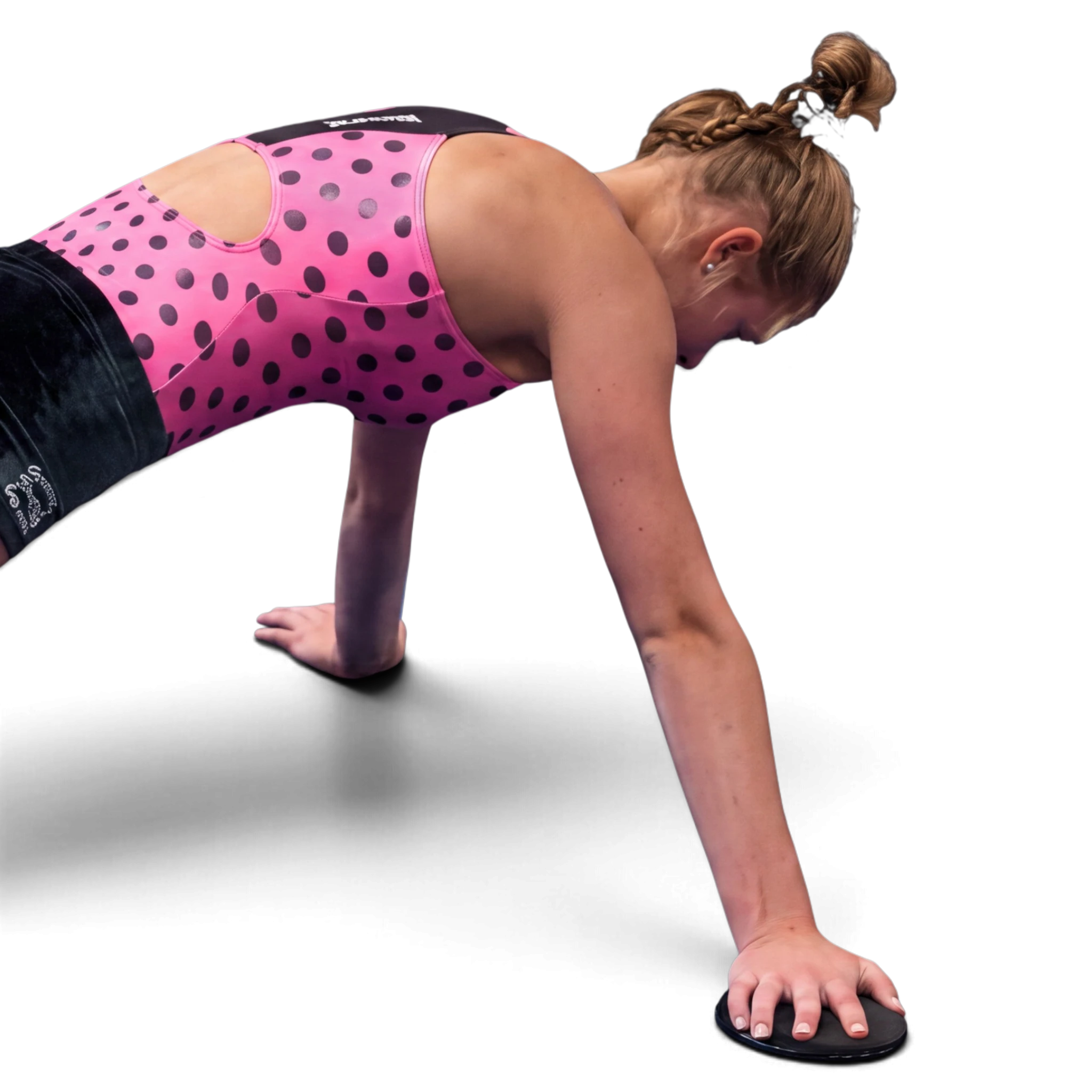 UK Gym Pits athlete using a standard slider for core conditioning and flexibility training on a black background