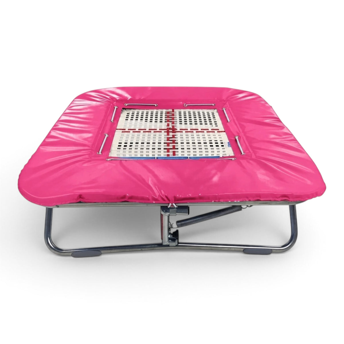 UK Gym Pits super mini trampoline with a pink coverall frame pad and a white web bed on a zinc plated steel frame.