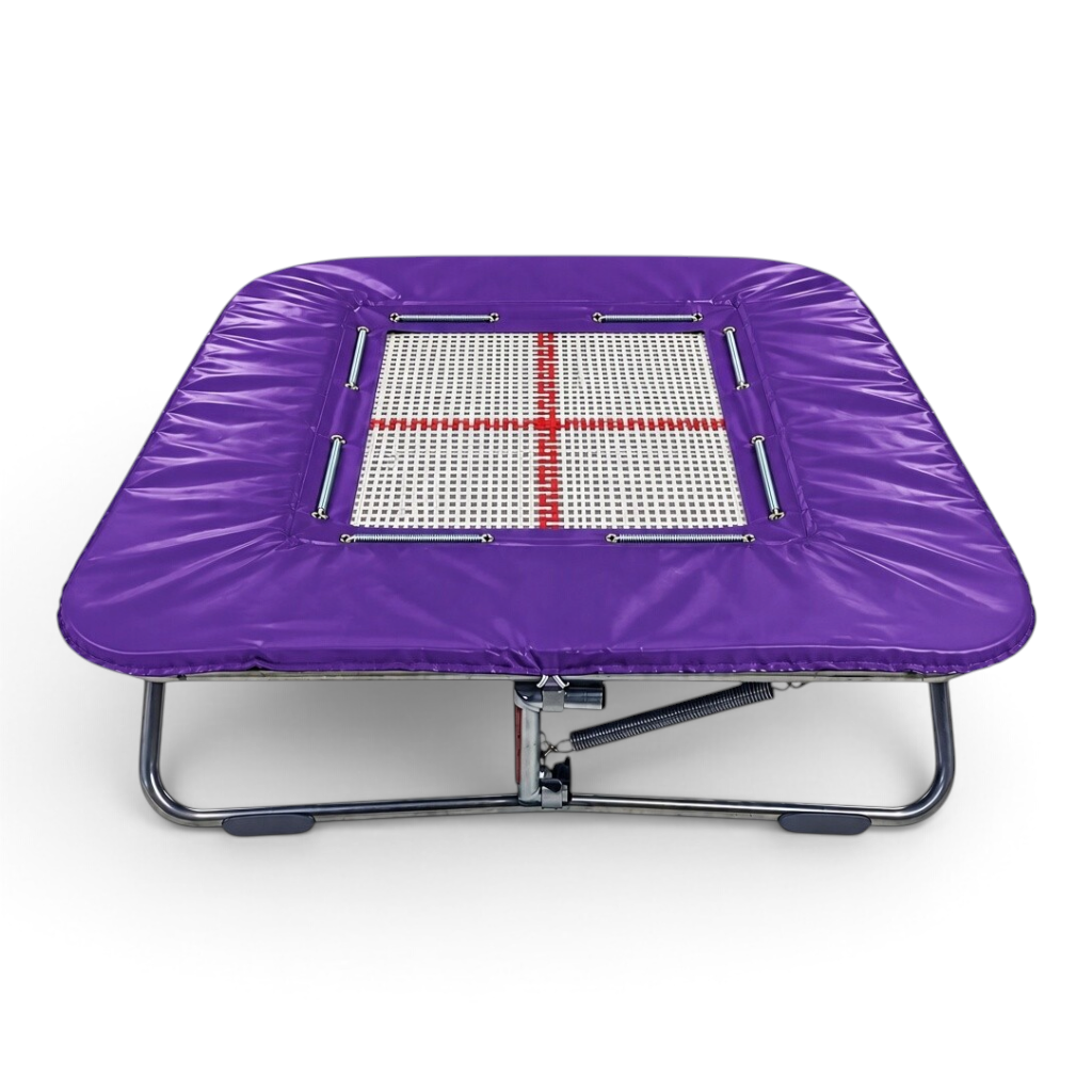 UK Gym Pits super mini trampoline with a white web bed and purple protective frame pads on a zinc plated steel frame.