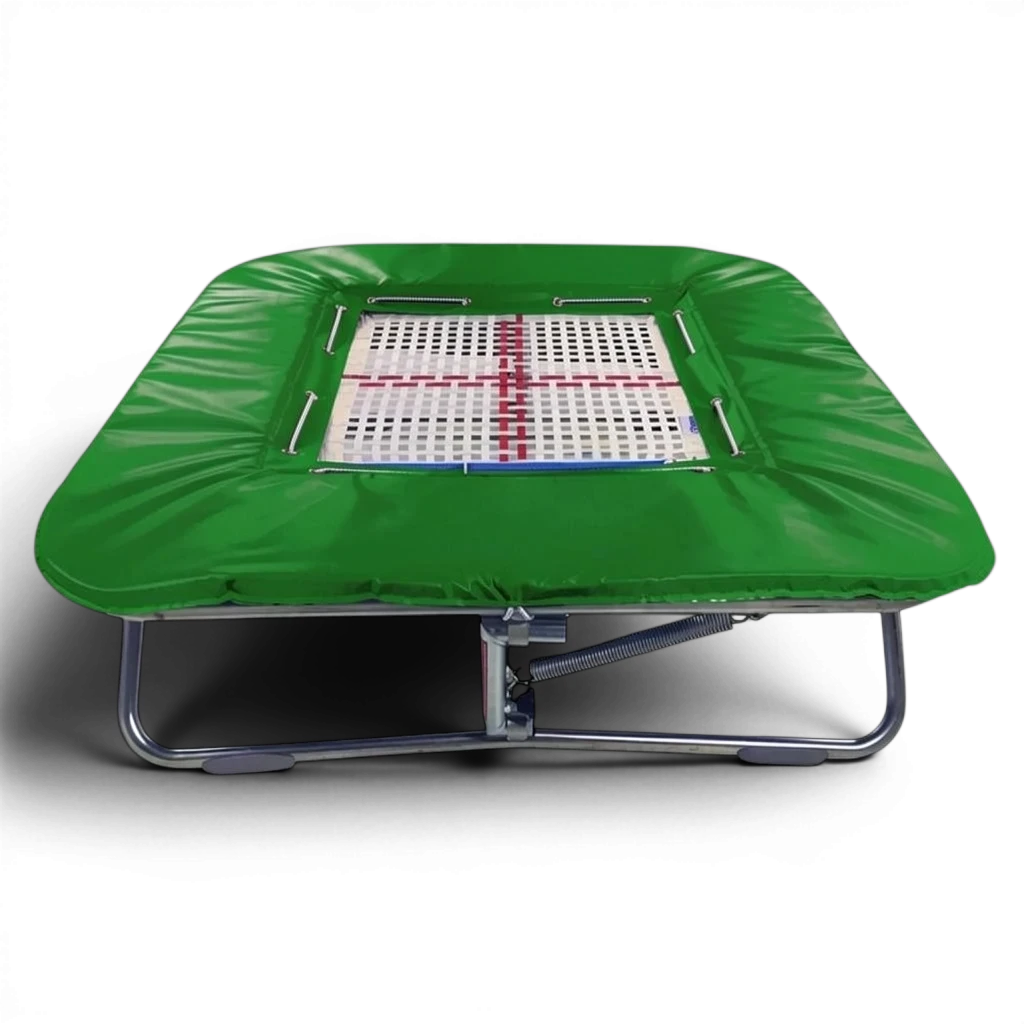 UK Gym Pits super mini trampoline with a white web bed and green protective frame pads on a black background.