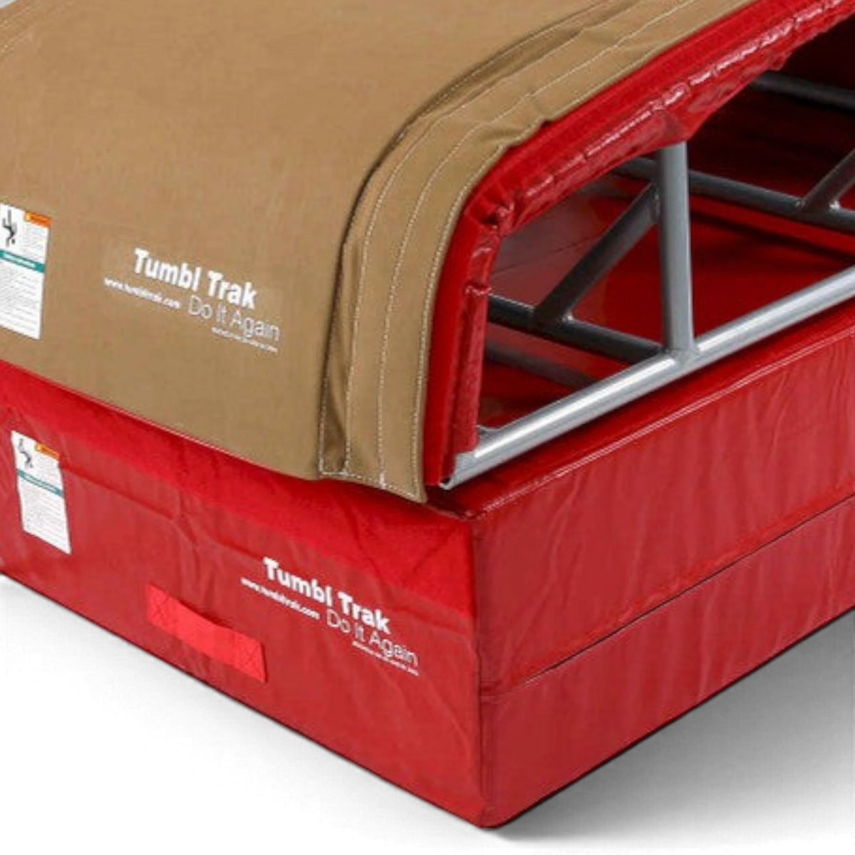 UK Gym Pits T-Trainer suede cover in tan attached to a red gym vault base for gymnastics training