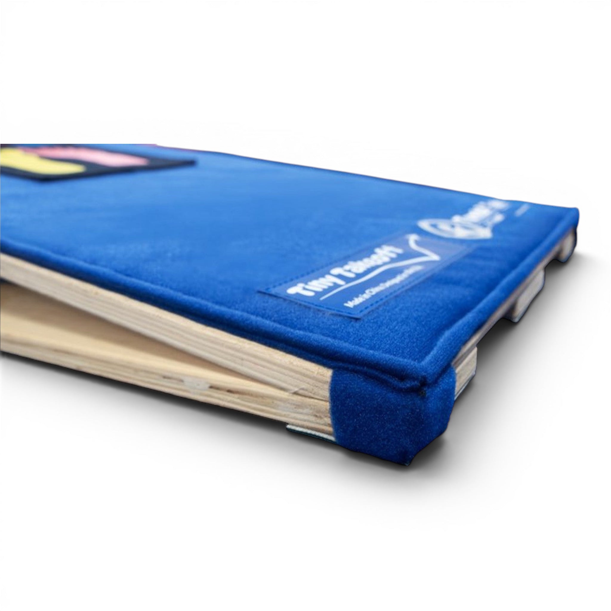 UK Gym Pits Tiny Takeoff blue carpeted gymnastics springboard with baltic birch wood base and rounded safety corners.