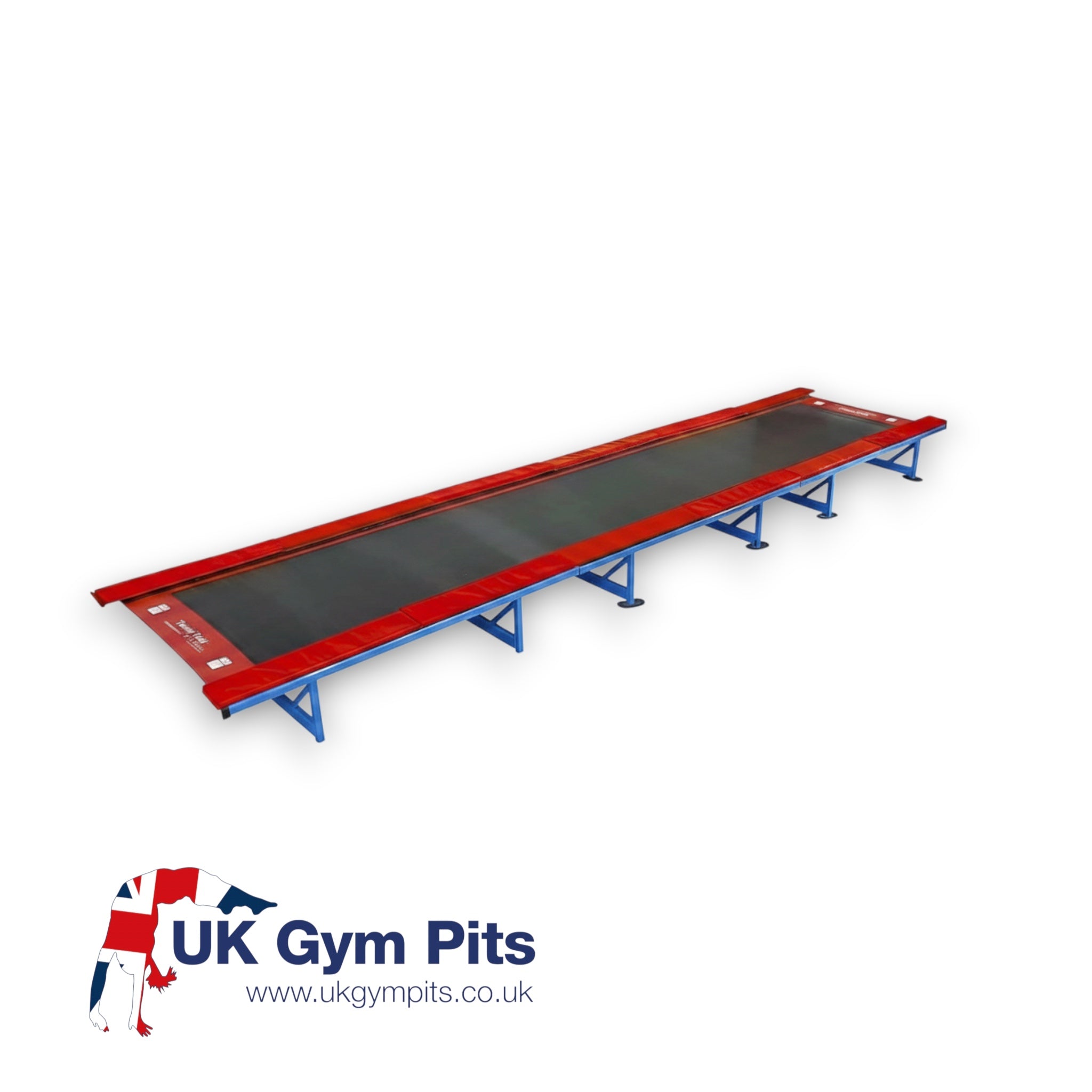 UK Gym Pits Tumbl Trak gymnastics training track with royal blue steel frame, black bed, and red safety pads.