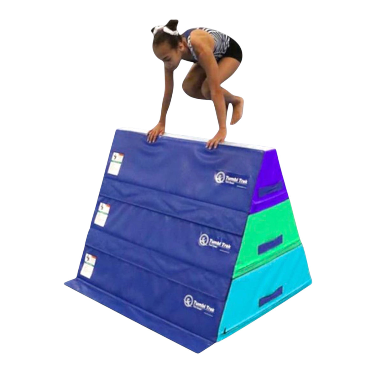UK Gym Pits Tumbl Trak pyramid beam blocks with a young gymnast practicing a jump on the stacked foam training surface