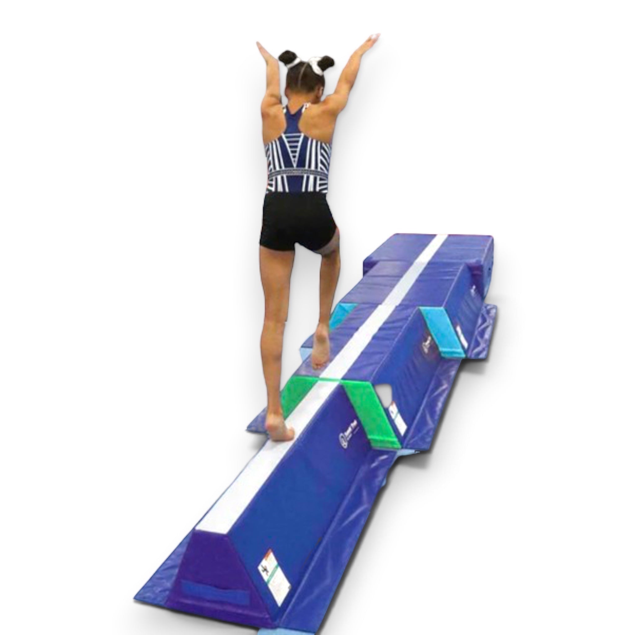 UK Gym Pits Tumbl Trak pyramid beam blocks with a gymnast practicing balance skills on the white center guide line.