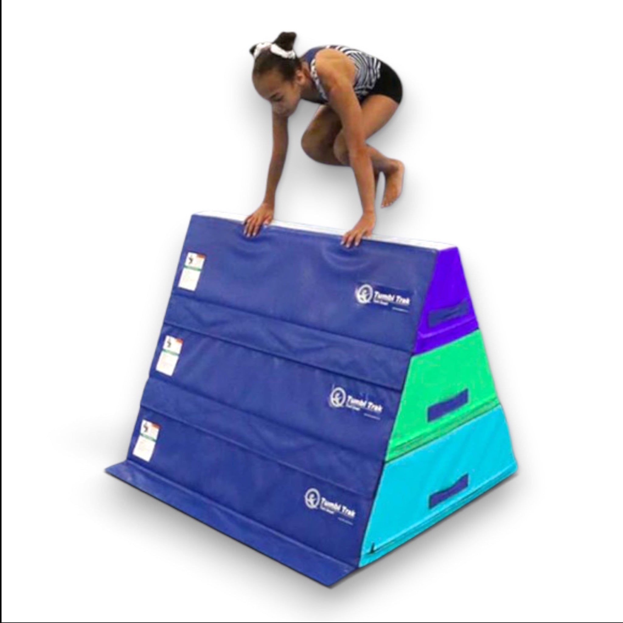 UK Gym Pits Tumbl Trak pyramid beam blocks with a gymnast practicing a jump on the stacked foam training equipment.