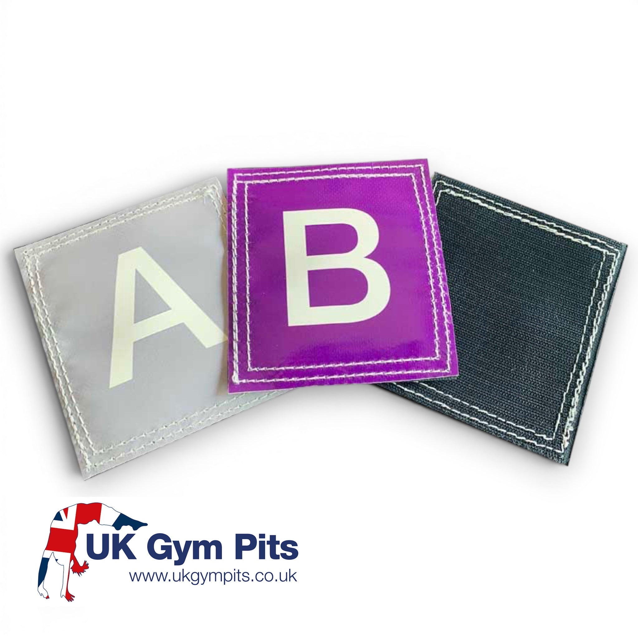 UK Gym Pits vinyl alphabet squares with velcro backing, featuring letters A and B in grey and purple for classrooms.