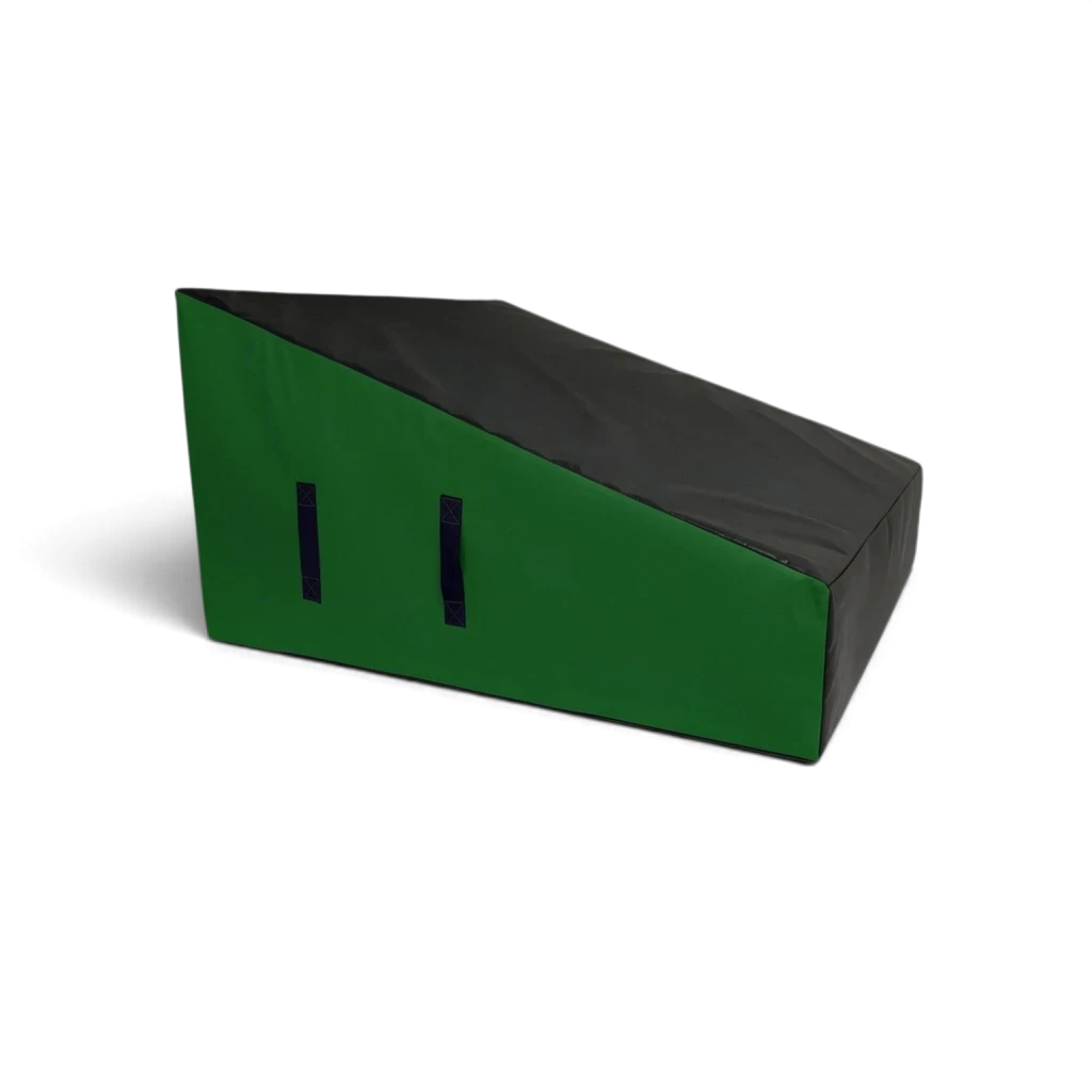 UK Gym Pits wide parkour wedge block in black and green, made of firm foam with carry handles for freestyle training.