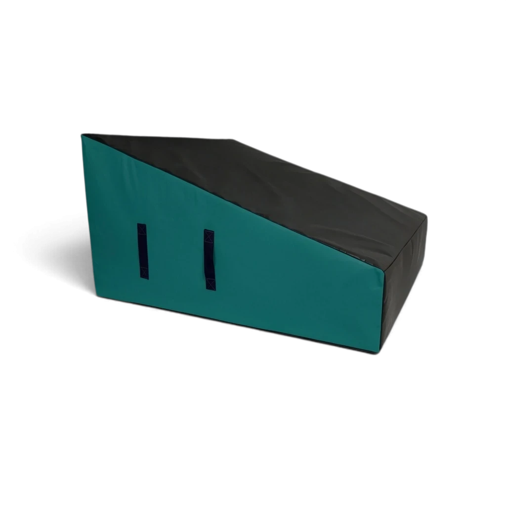 UK Gym Pits wide parkour wedge block in black and teal with carry handles, made from firm high-density foam.