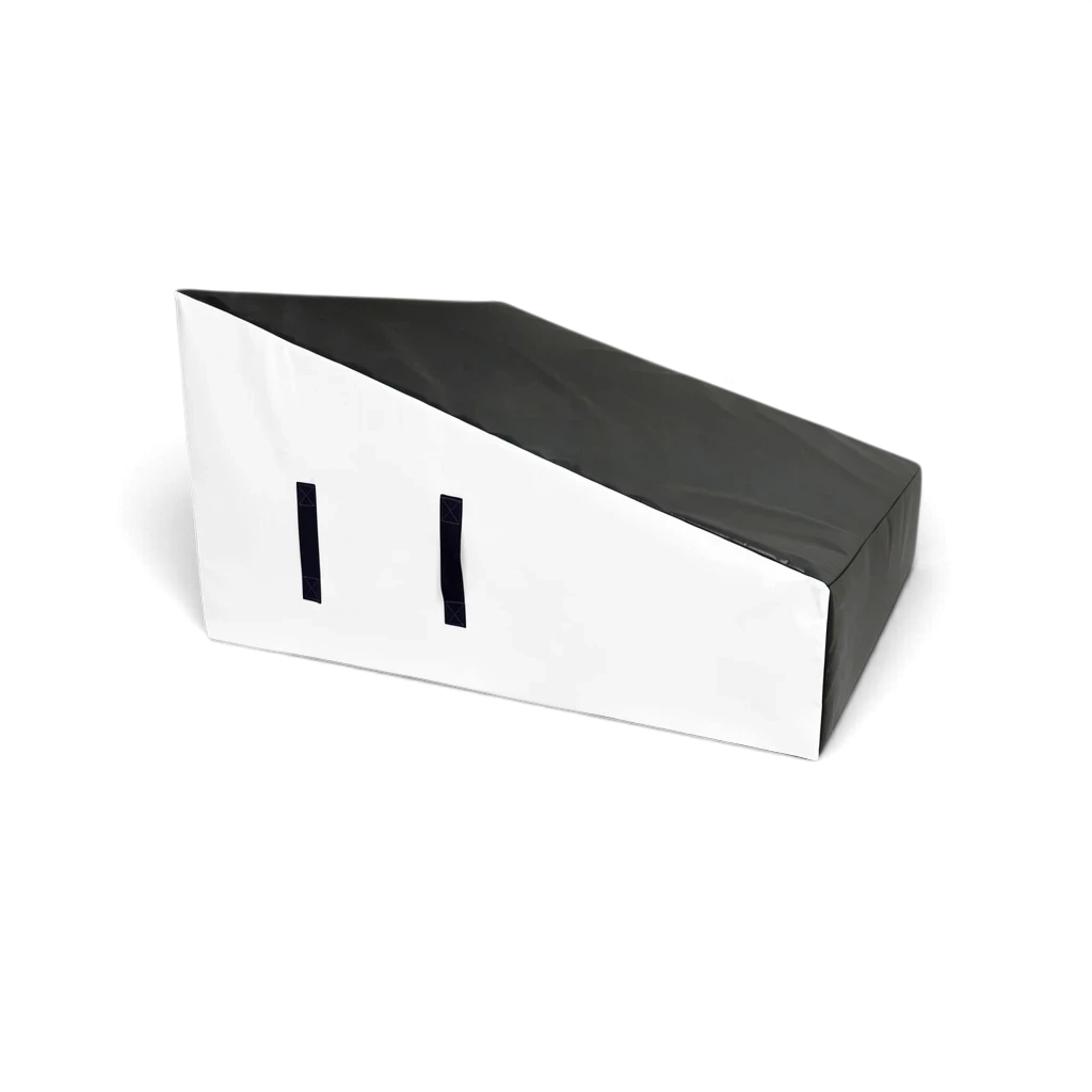 UK Gym Pits wide parkour wedge block in black and white, made of firm foam with a durable PVC cover and carry handles.
