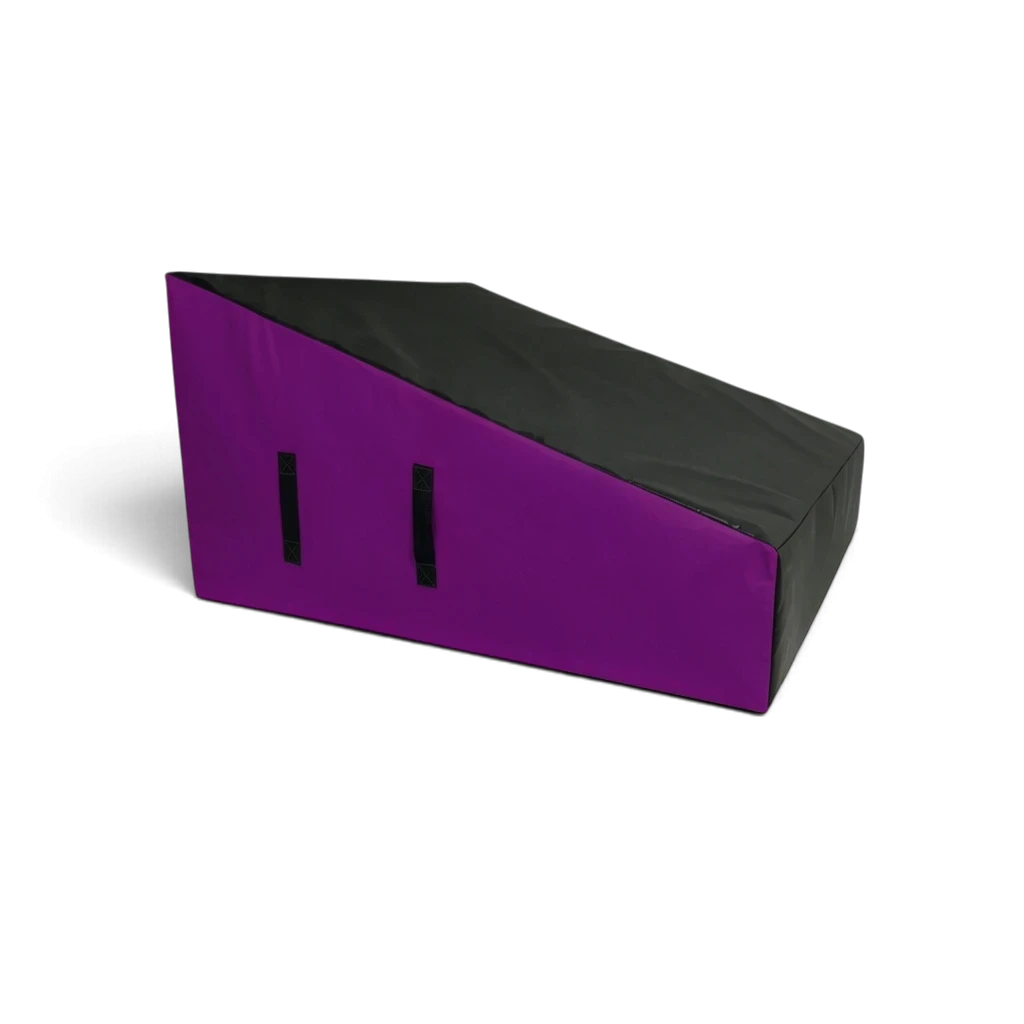 UK Gym Pits wide parkour wedge block with black top and purple sides, featuring carry handles and firm foam design.