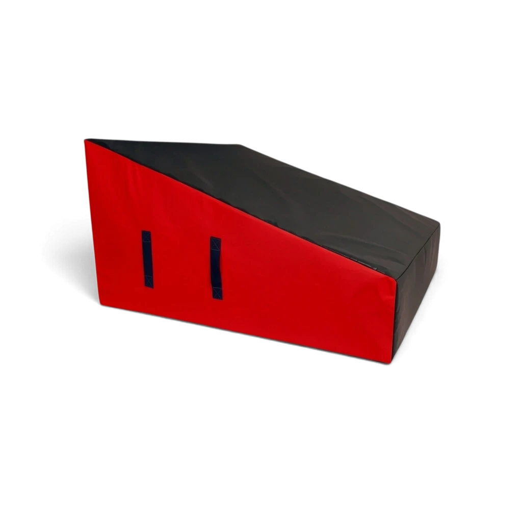 UK Gym Pits wide parkour wedge block in black and red, featuring high-density foam, carry handles, and a PVC surface.