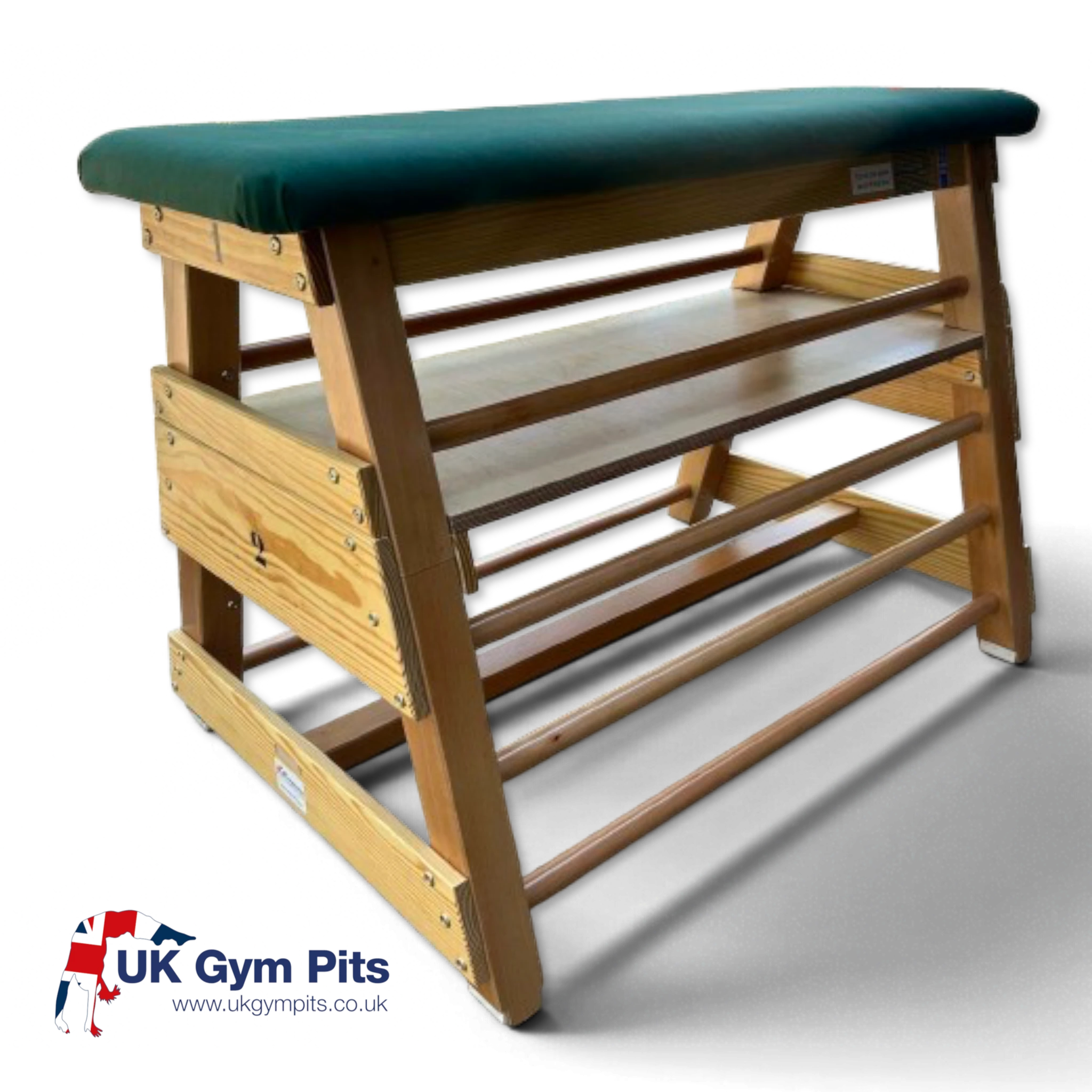 UK Gym Pits wooden gymnastics bar box with a green canvas padded top and integrated wooden rungs for training