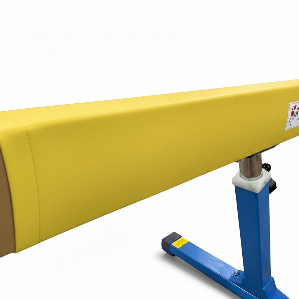 UK Gym Pits yellow cushioned gymnastics beam mat with faux leather surface and secure Velcro attachment