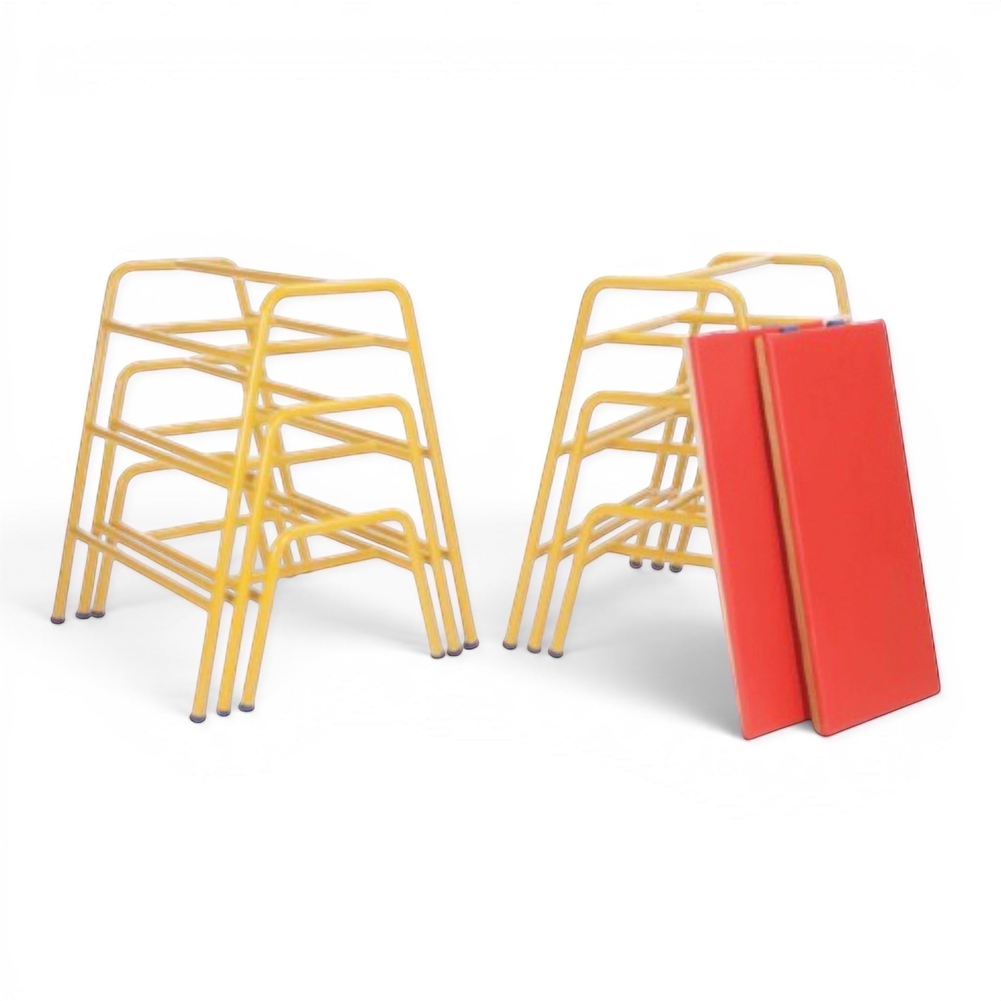 UK Gym Pits yellow tubular steel trestles and red padded tops for gymnastics agility training