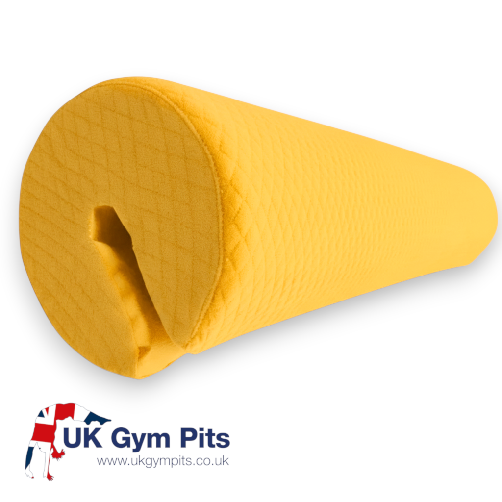 UK Gym Pits yellow parallel bars safety pad with a textured jersey fabric cover for gymnastics shock absorption.