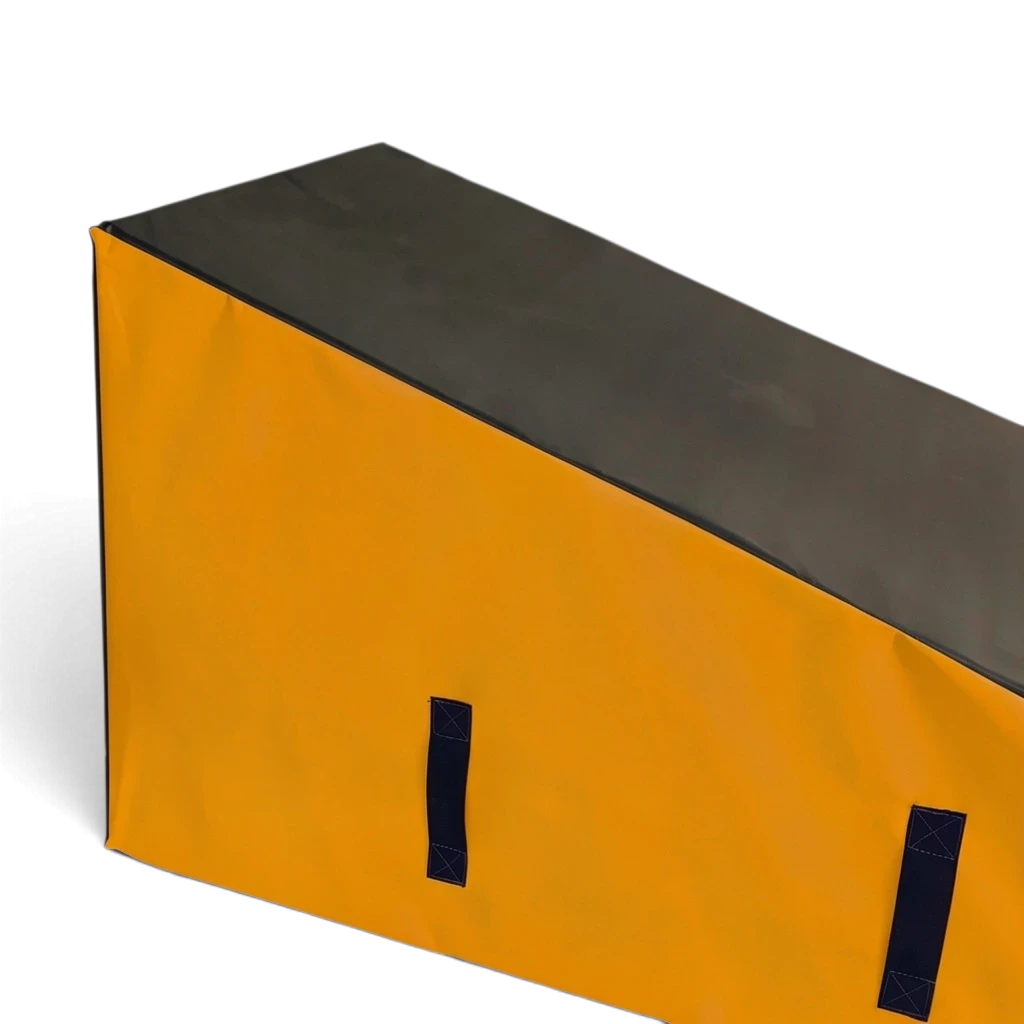 UK Gym Pits parkour wedge block with a black top and yellow sides, featuring carry handles for training obstacles.
