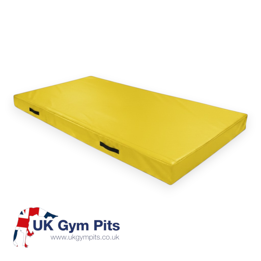 UK Gym Pits yellow rectangular push-on safety mat with black side handles and reinforced PVC cover